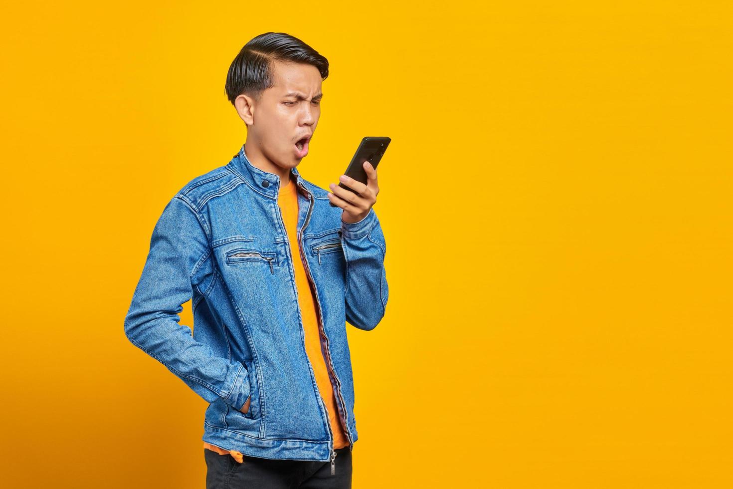 portrait of asian man angry when talk at smartphone photo