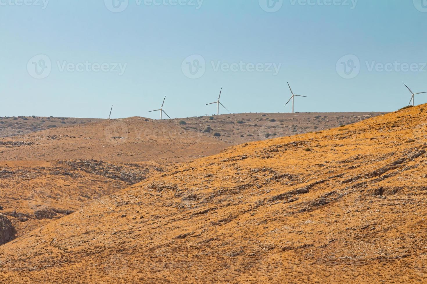 Wind turbines at a wind farm on a mountain in the Israeli Golan Heights photo