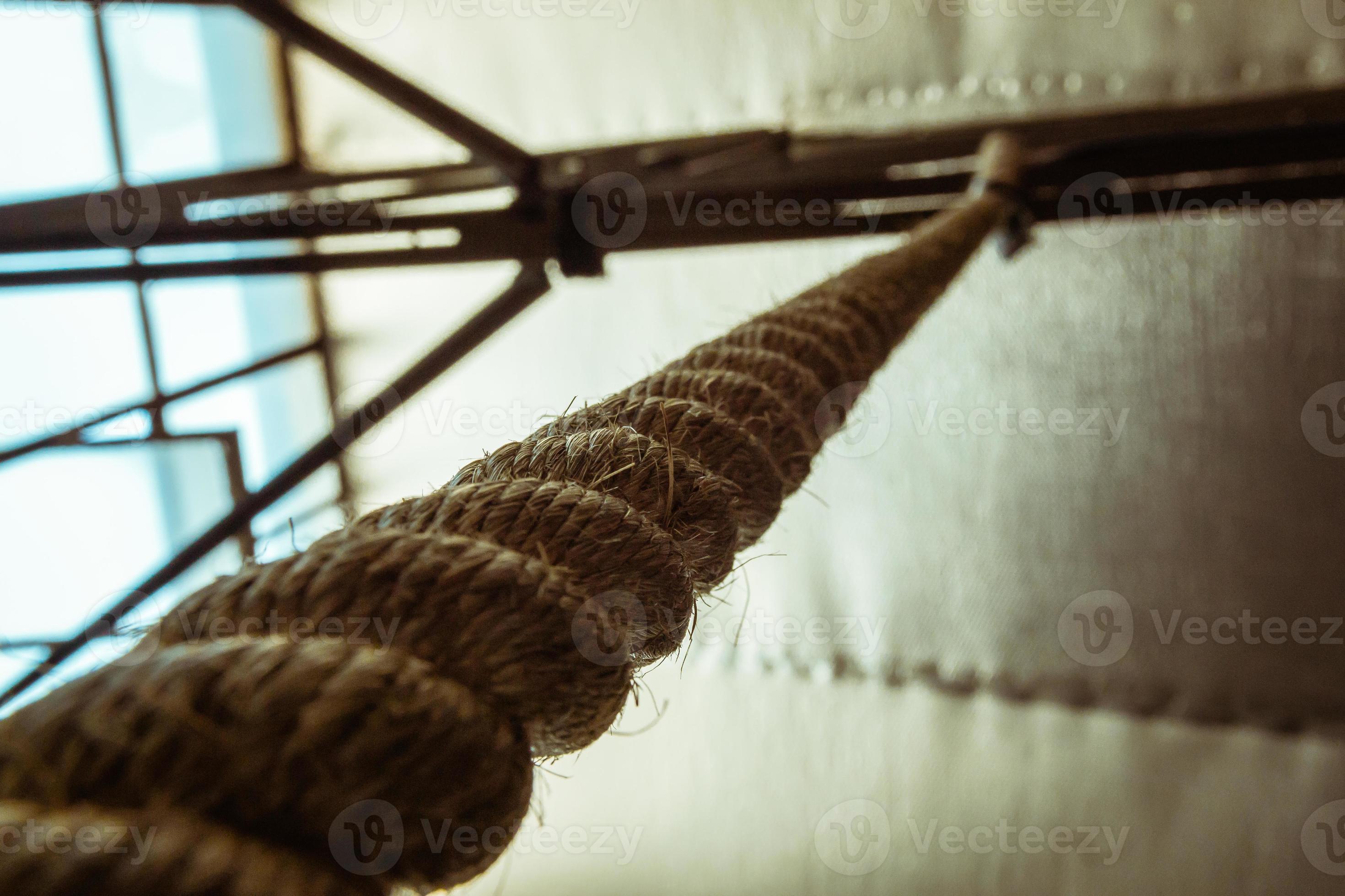 Brown climbing rope hanging from roof 3690499 Stock Photo at Vecteezy