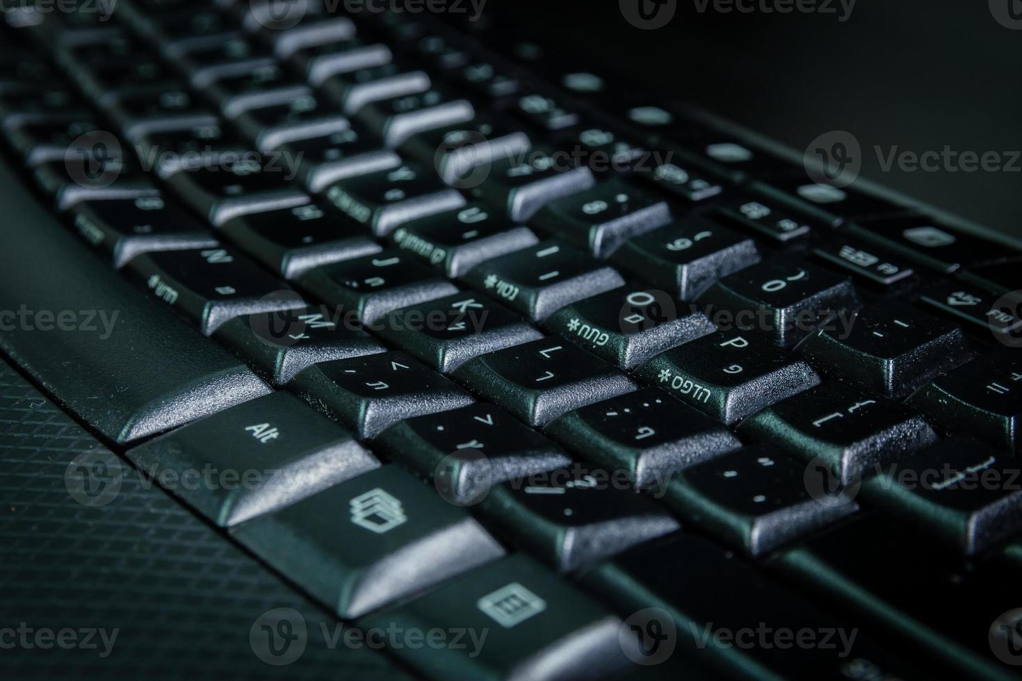 Keyboard with letters in Hebrew and English photo