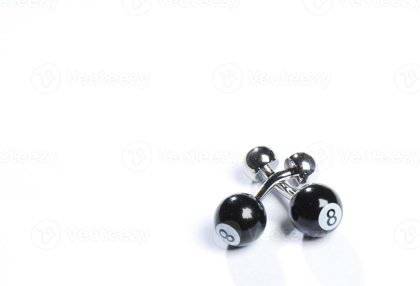 A pair of stainless steel cufflinks on white background photo