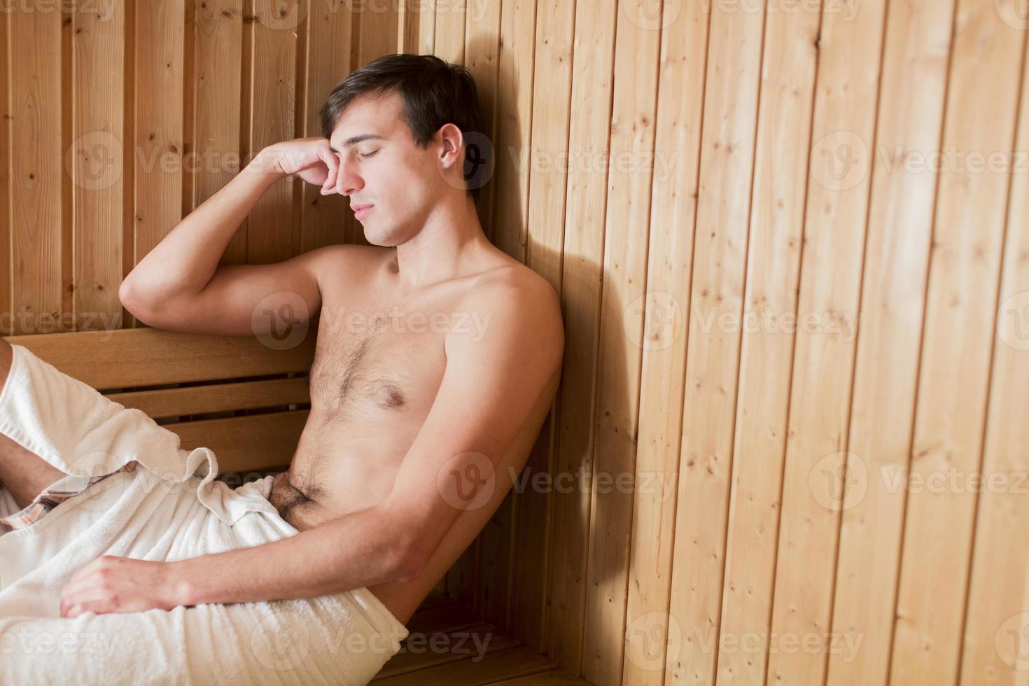 Young man in the sauna photo