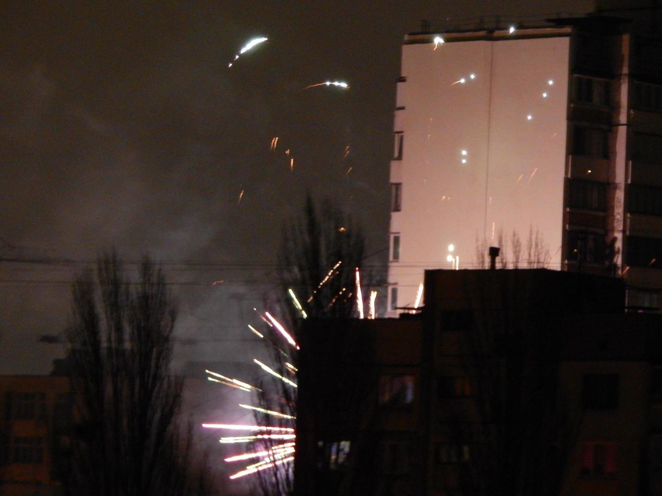 New Year fireworks over the city at night photo