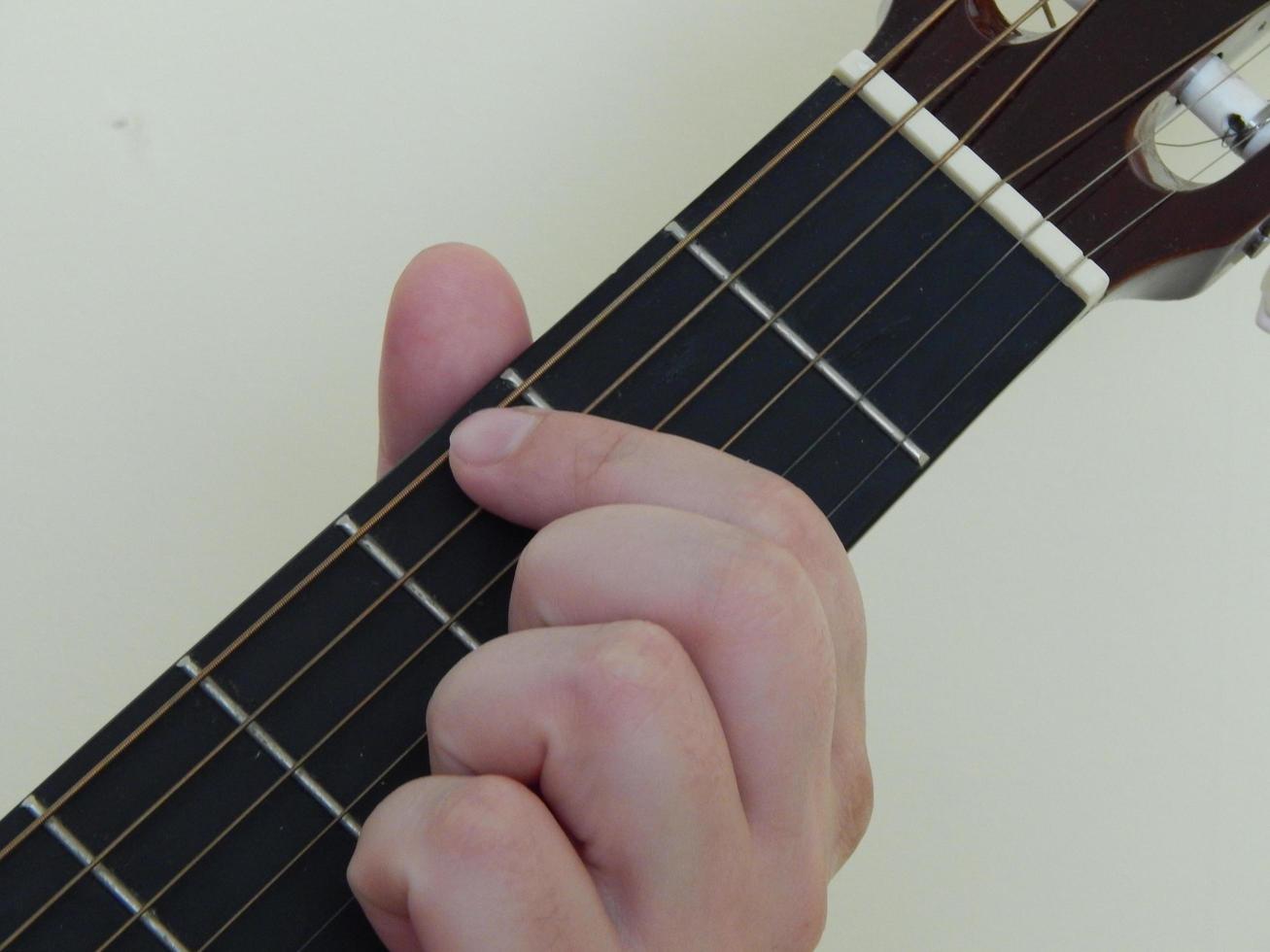 Playing hands on guitar music photo