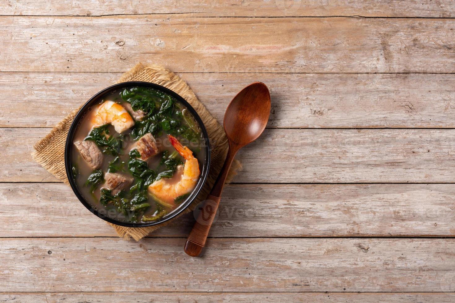 Beef, okra stew and spinach soup in bowl photo