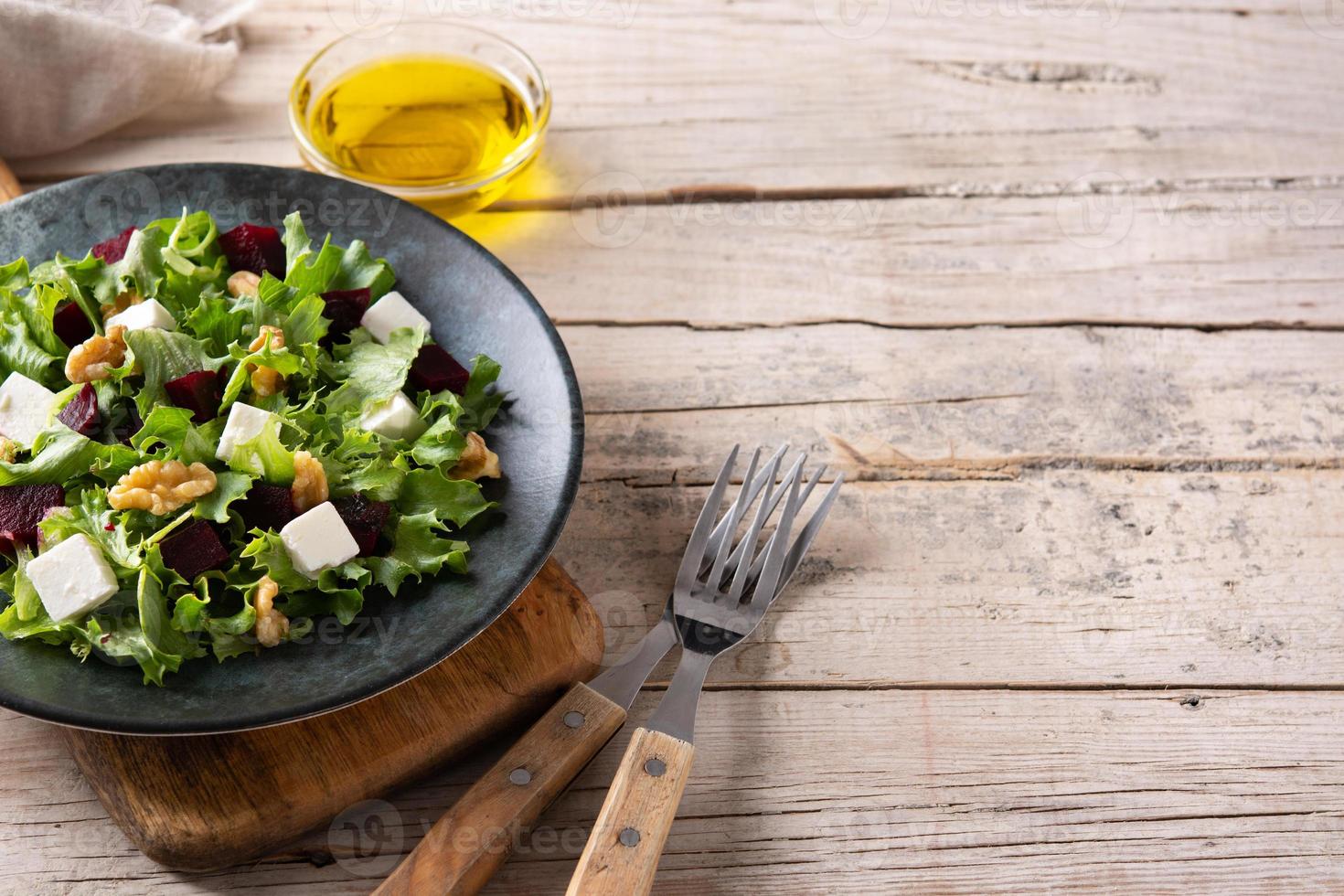 Beetroot salad with feta cheese,lettuce and walnuts photo