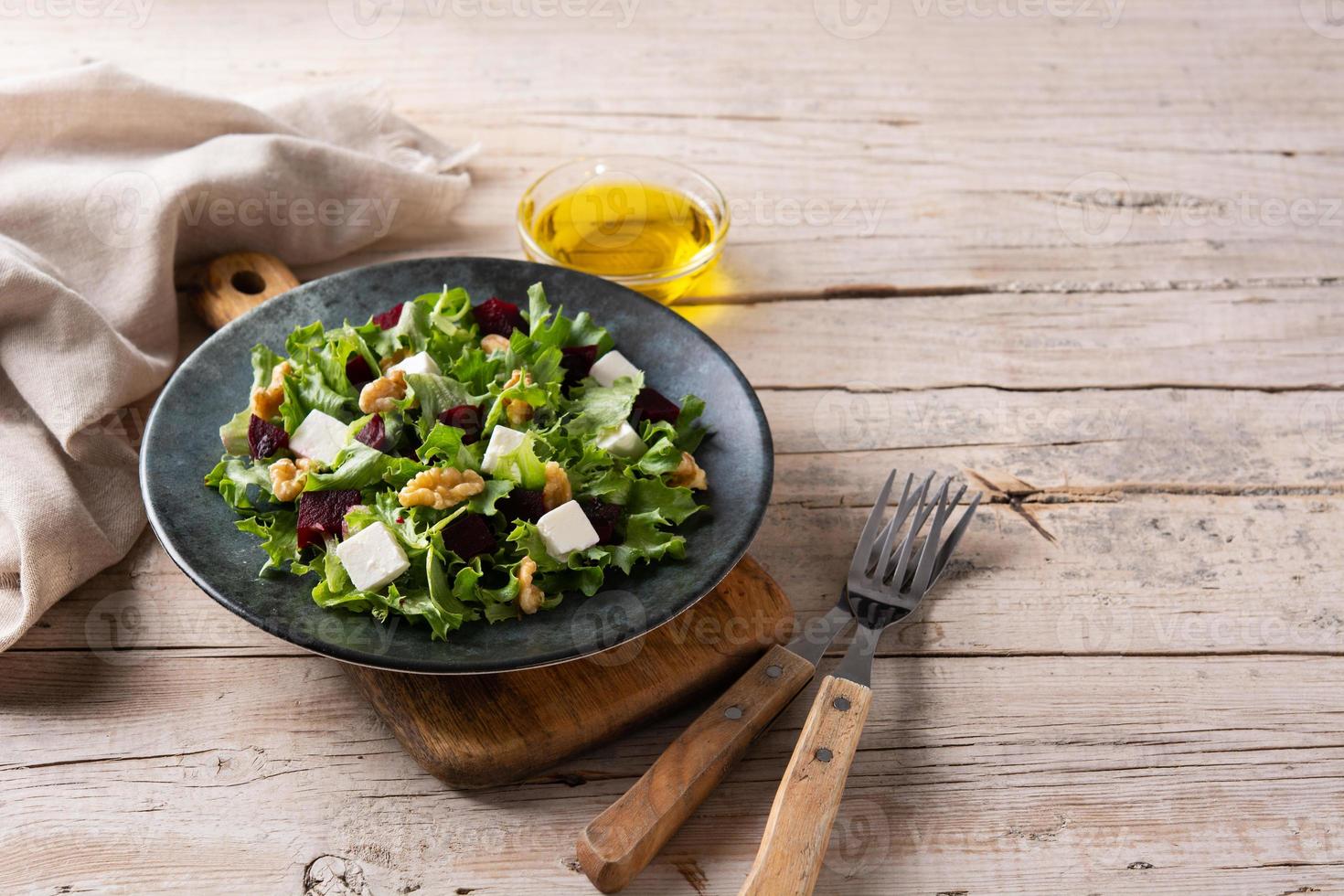 Beetroot salad with feta cheese,lettuce and walnuts photo