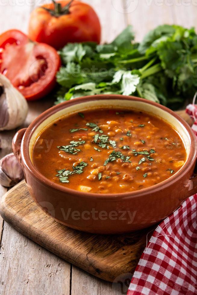 Red lentil soup in bowl photo