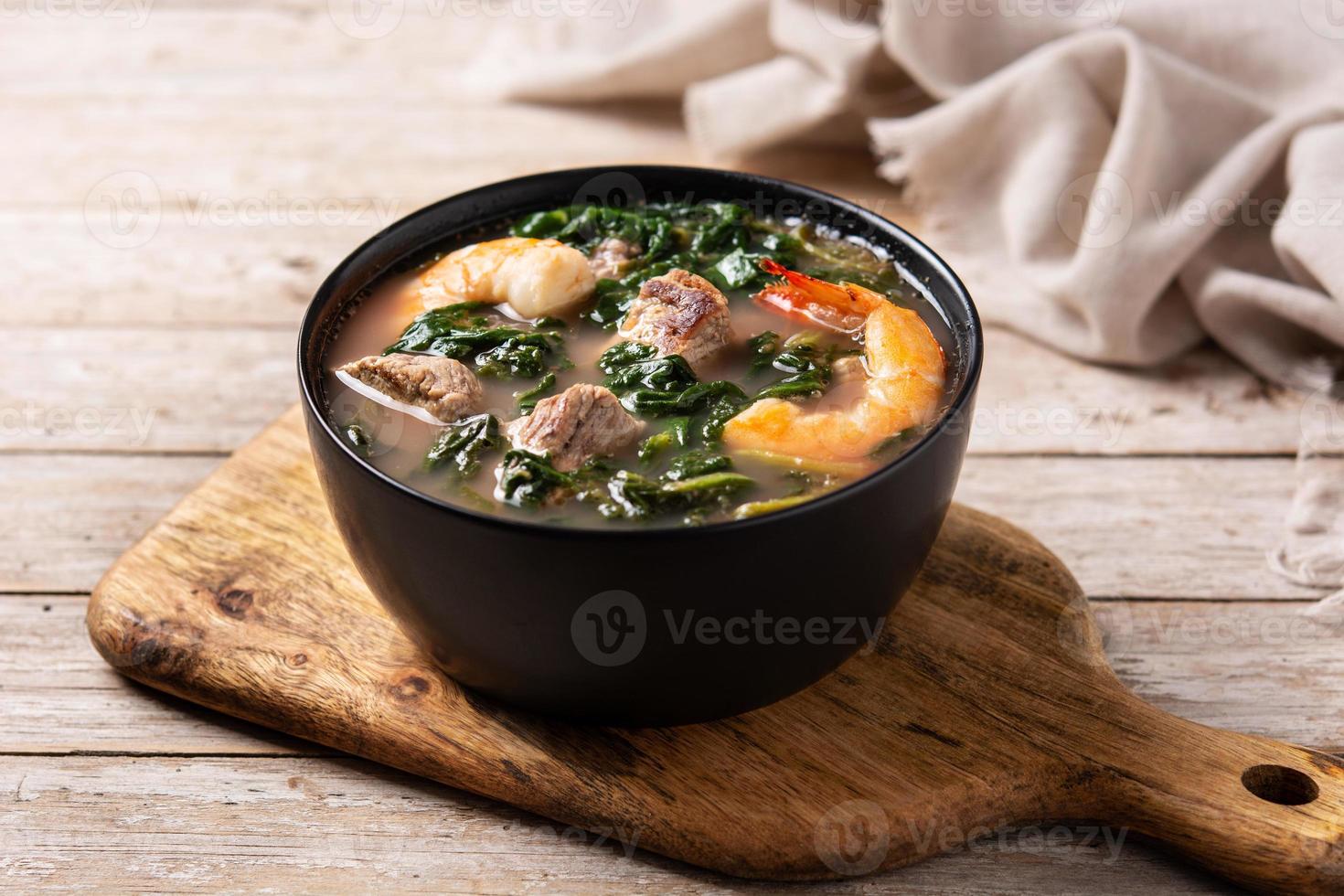 Beef, okra stew and spinach soup in bowl photo