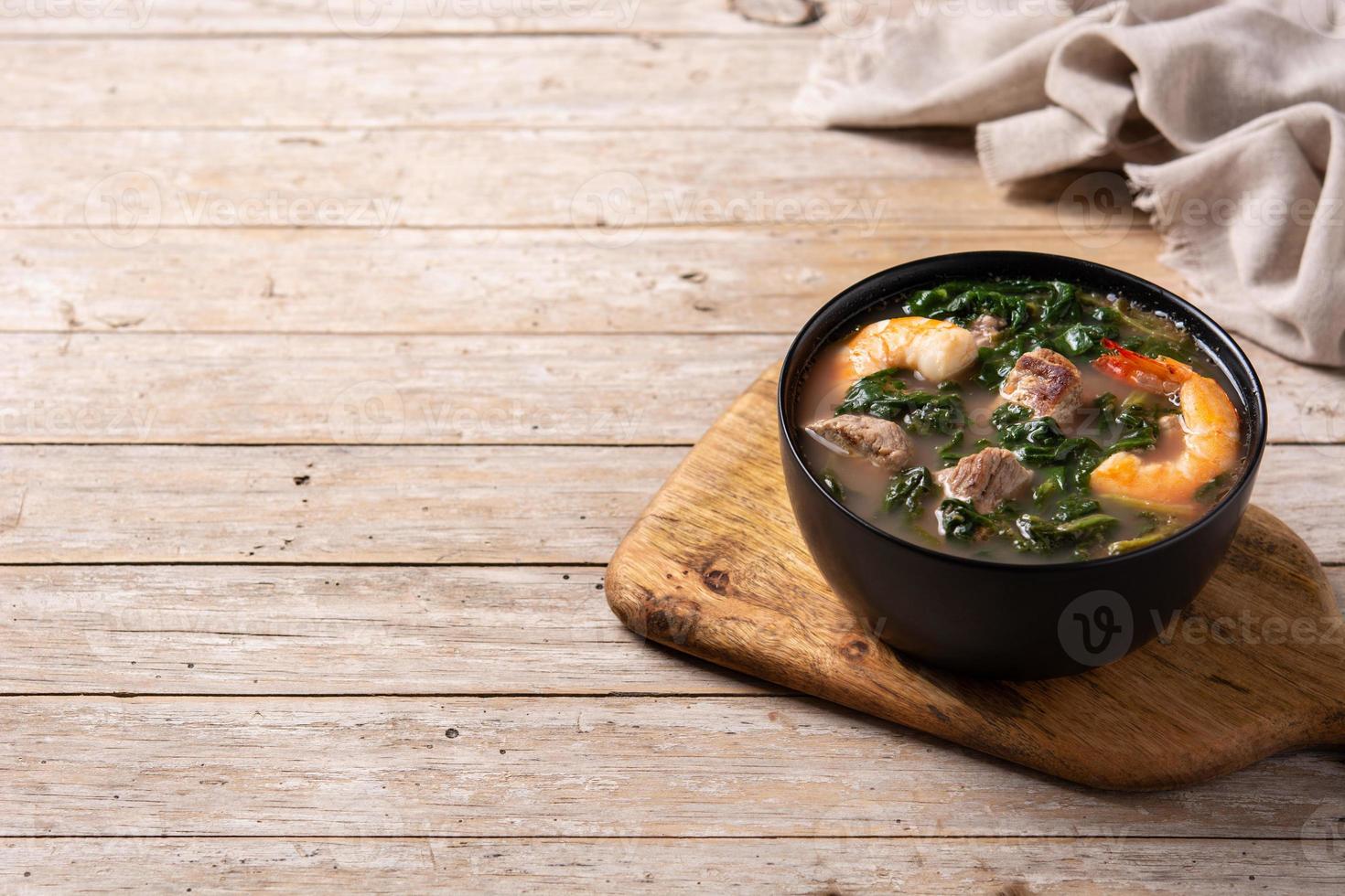 Beef, okra stew and spinach soup in bowl photo