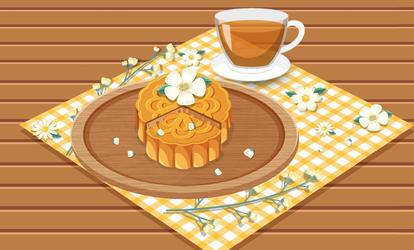 Mooncake con taza de té en mesa de madera vector