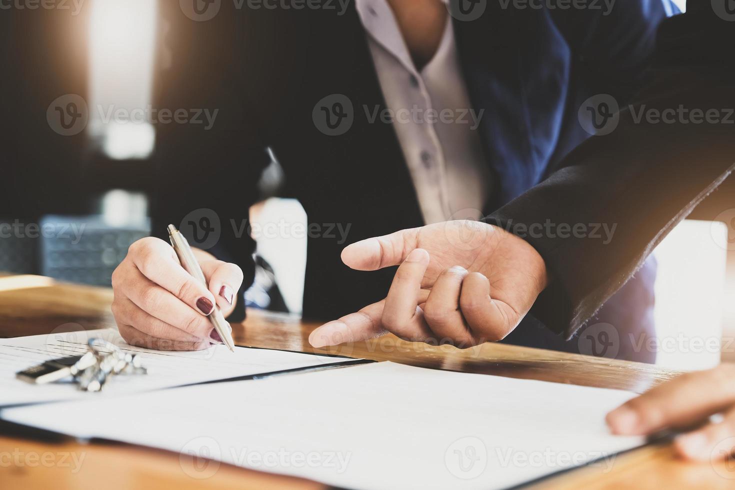 estate agent gives pen and documents agreement with customer to sign contract. Concept agreement. photo