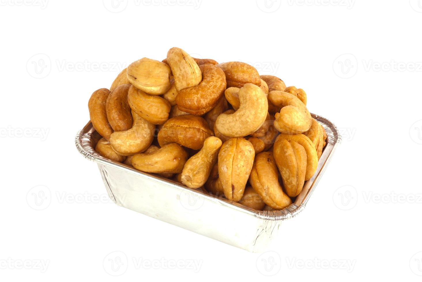 Roasted cashews in aluminum foil tray photo