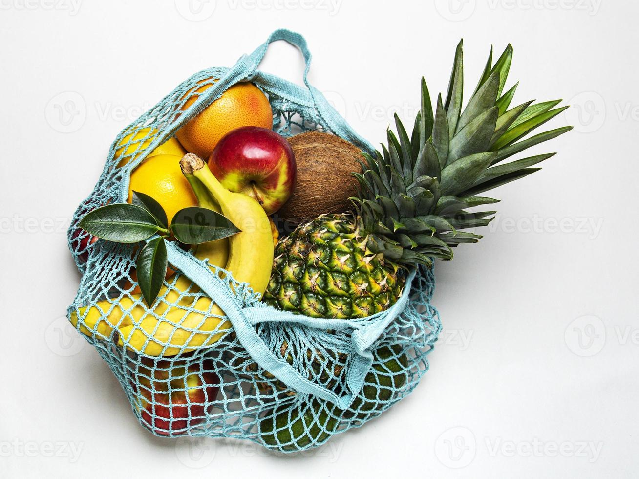 Mesh shopping bag with fruits photo