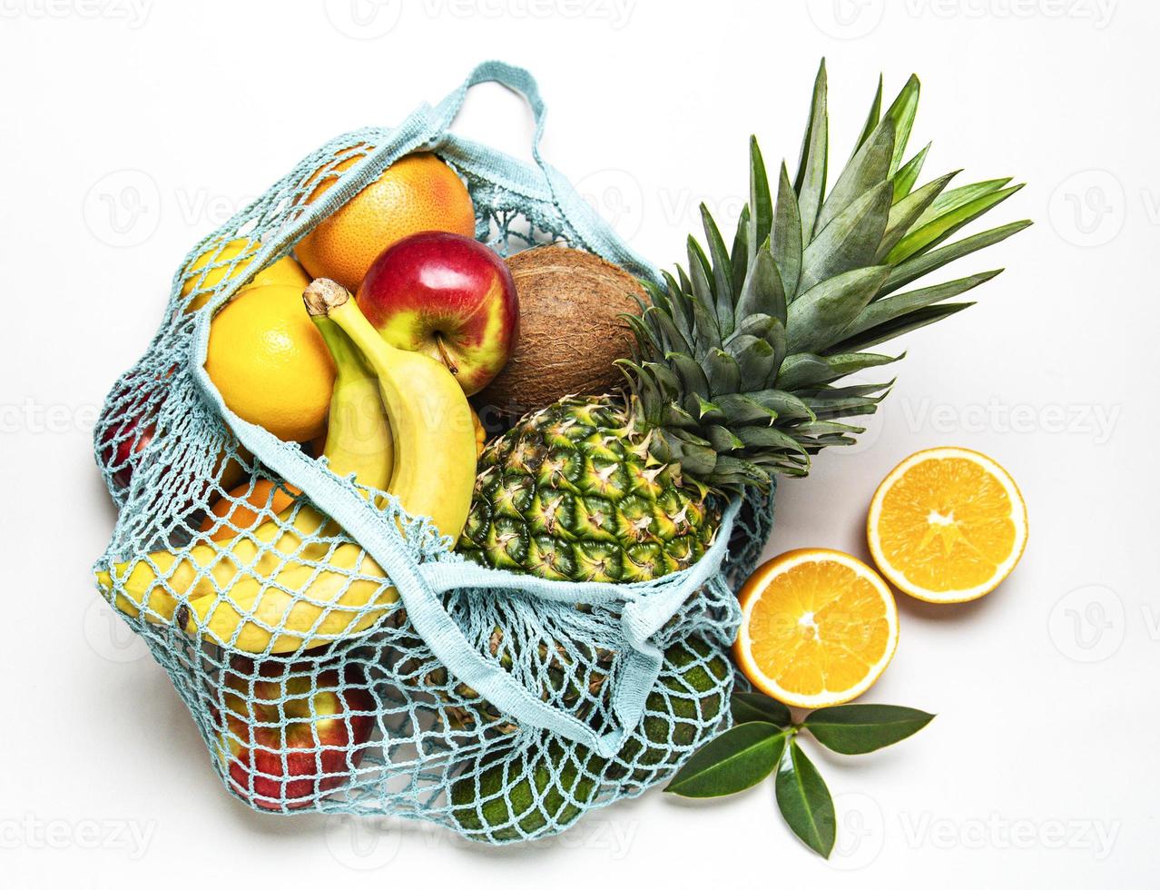 Mesh shopping bag with fruits photo