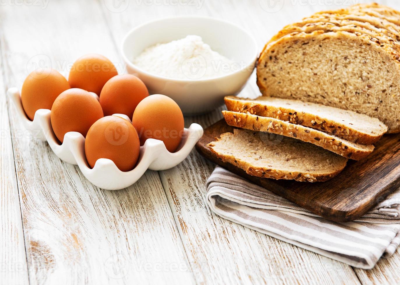 Bread, eggs and flour photo