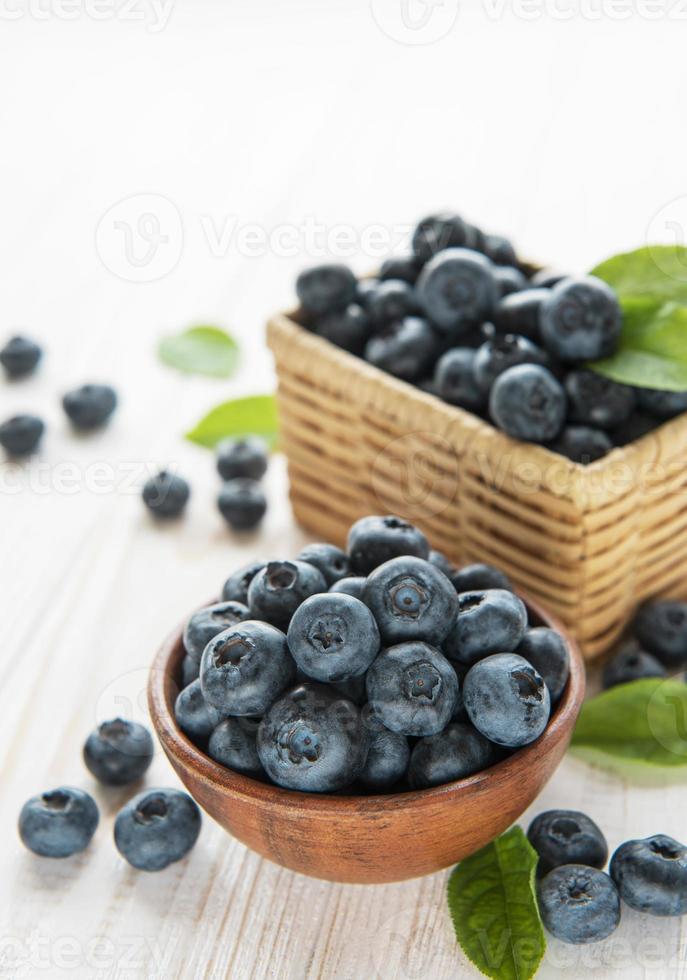 Blueberries on old wooden background photo