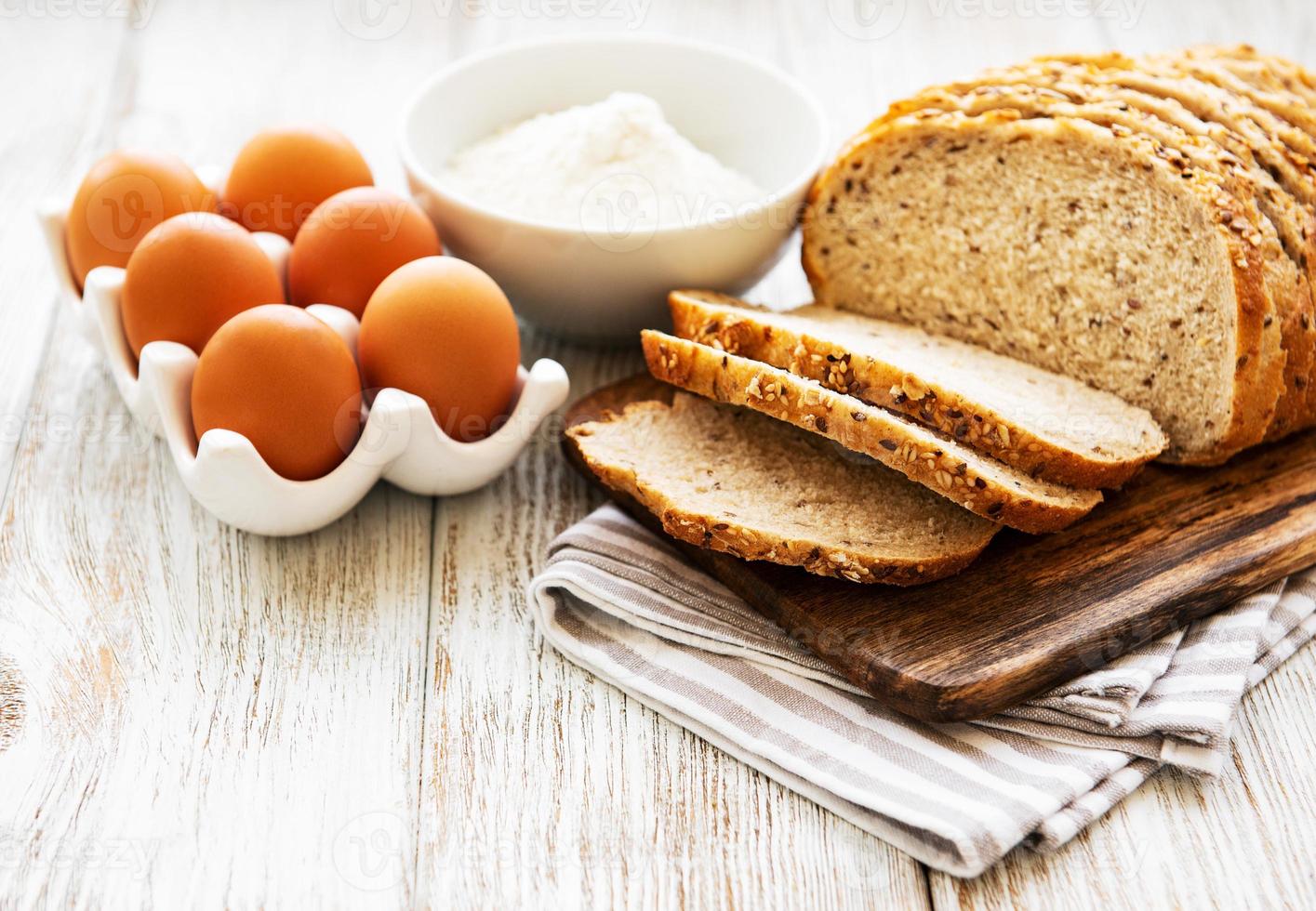 Bread, eggs and flour photo