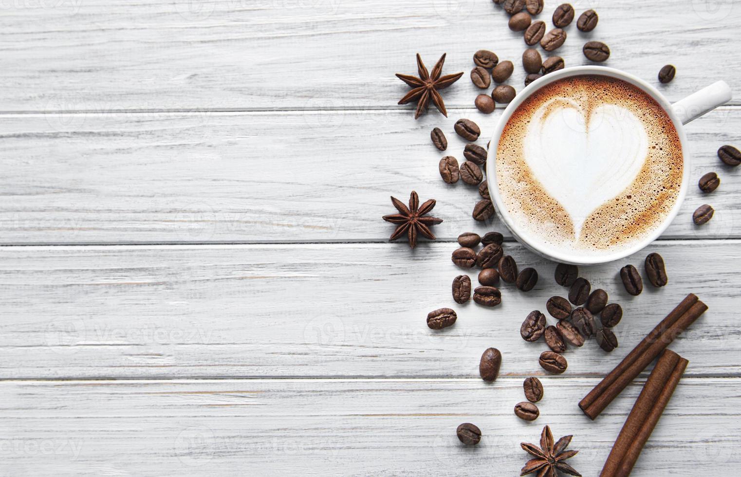 A cup of coffee with heart pattern photo