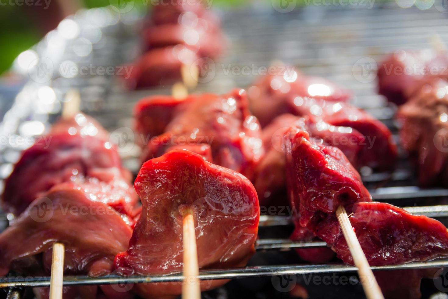 Different types of meat are cooked on the grill photo