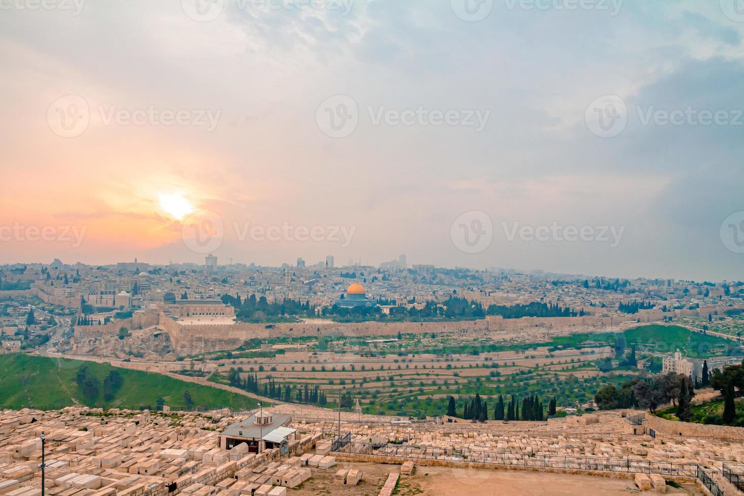 Panoramic view of Jerusalem old city and the Temple Mount during a dramatic colorful sunset photo