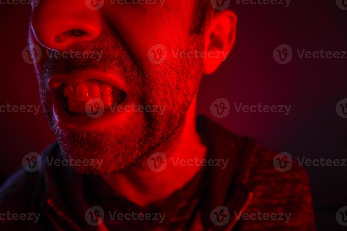 Man with angry facial expression photo