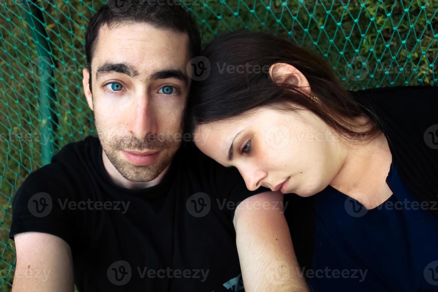 Top view of couple relaxing in hammock together photo