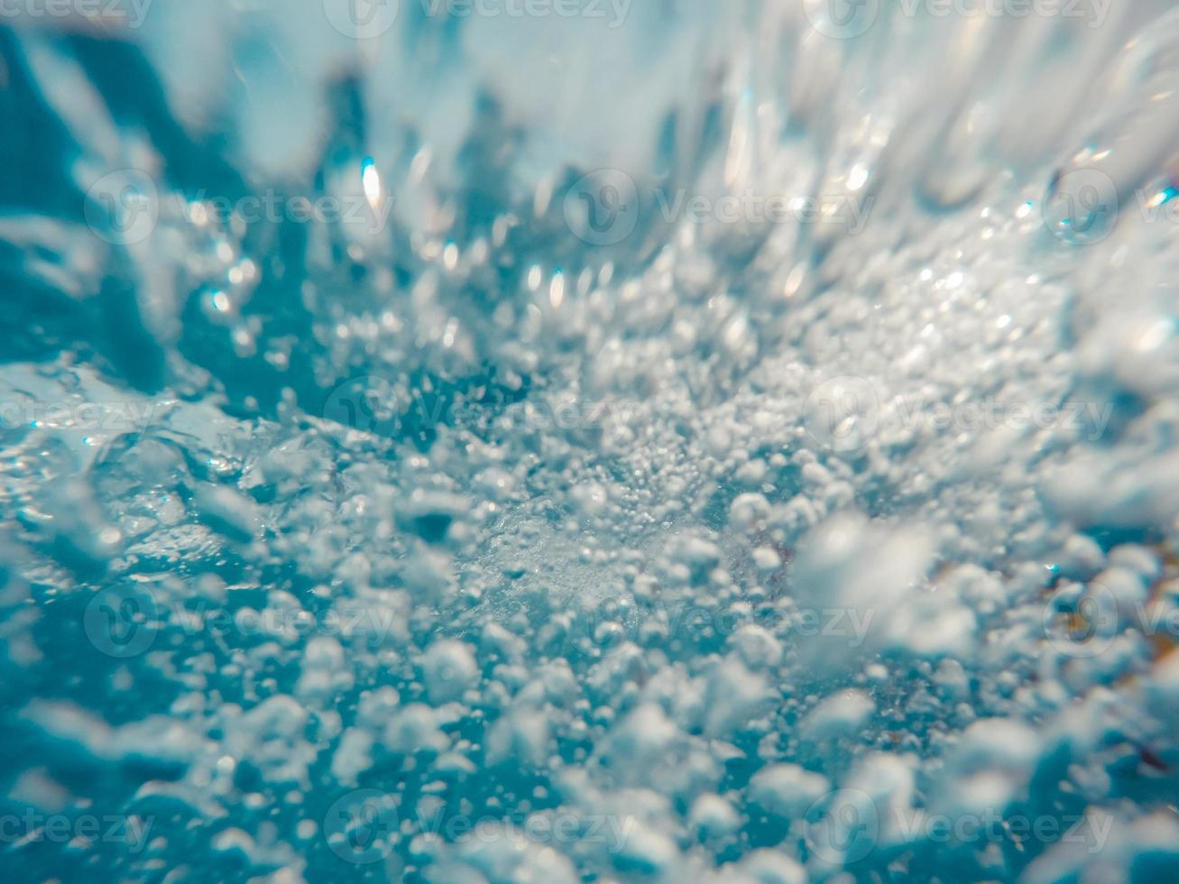 Underwater view of bubbles in motion photo