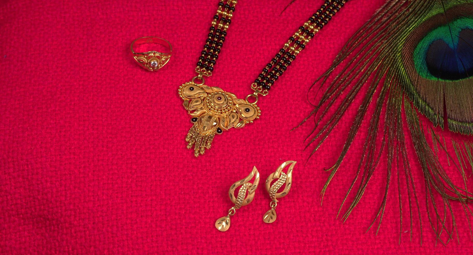 Mangalsutra or Golden Necklace to wear by a married hindu women, arranged with beautiful backgrond. Indian Traditional Jewellery. photo