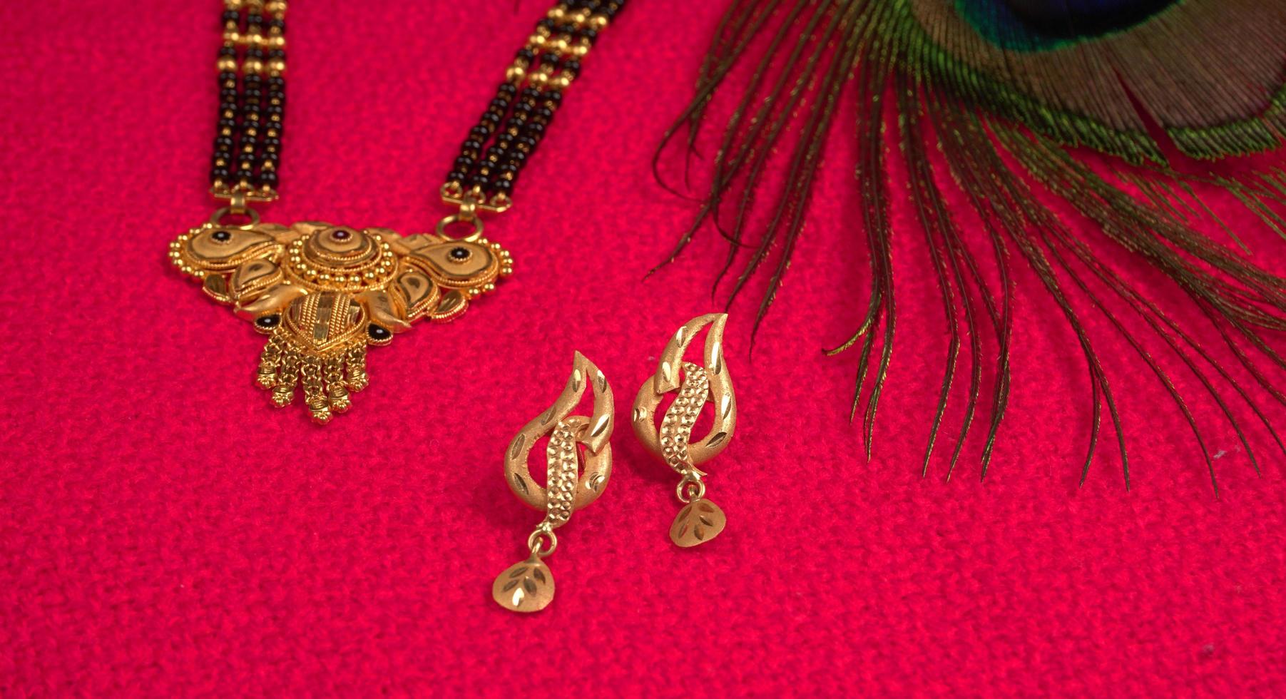 Mangalsutra or Golden Necklace to wear by a married hindu women, arranged with beautiful backgrond. Indian Traditional Jewellery. photo