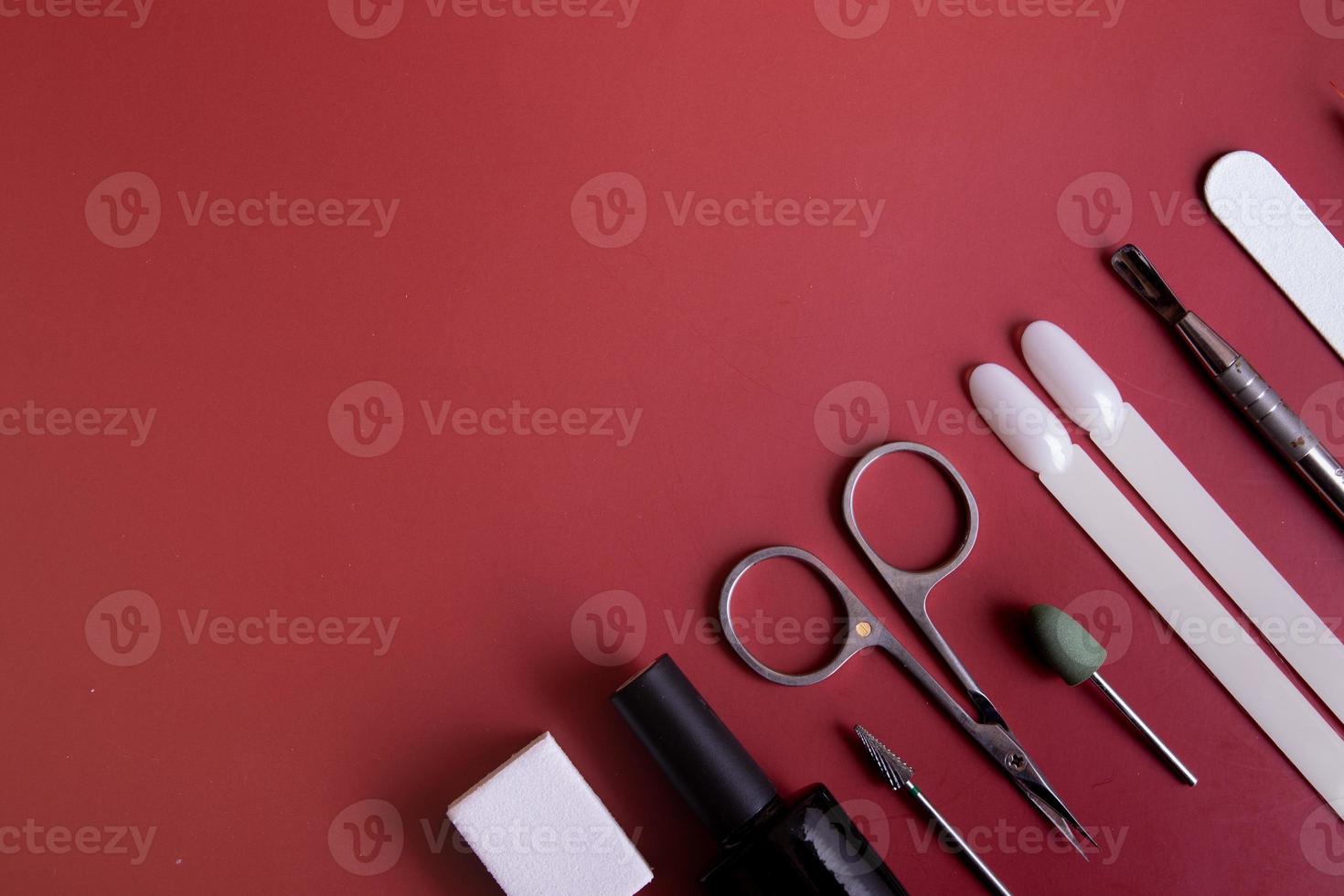 Manicure tools and tips on a colored background with copy space photo
