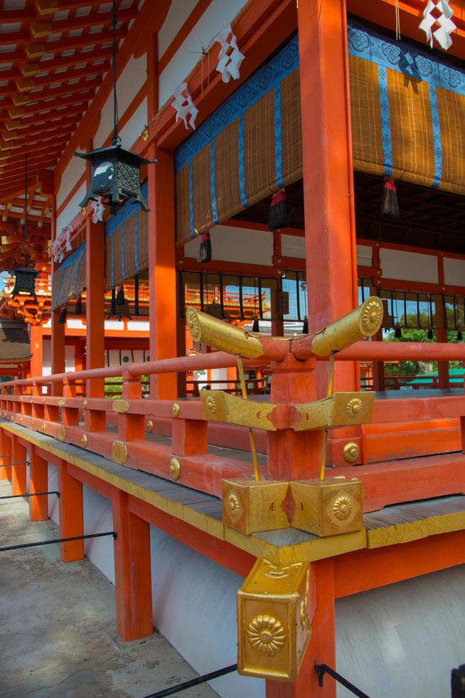 Red and golden temple Fushimi Inari shrine, near Kyoto, Japan photo