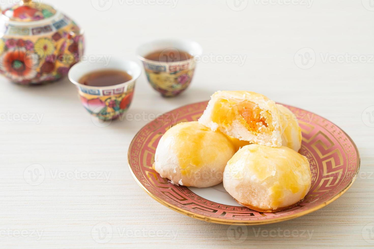 Chinese pastry moon cake with salted egg peanut or Spring Roll pastry with nuts and salted eggs photo