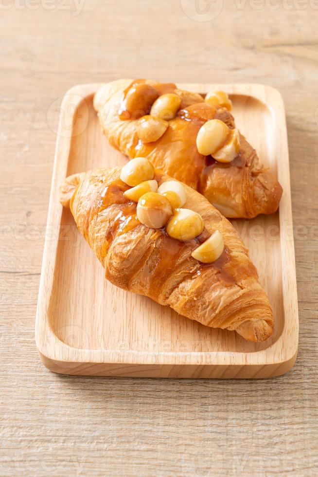 croissant with macadamia and caramel photo