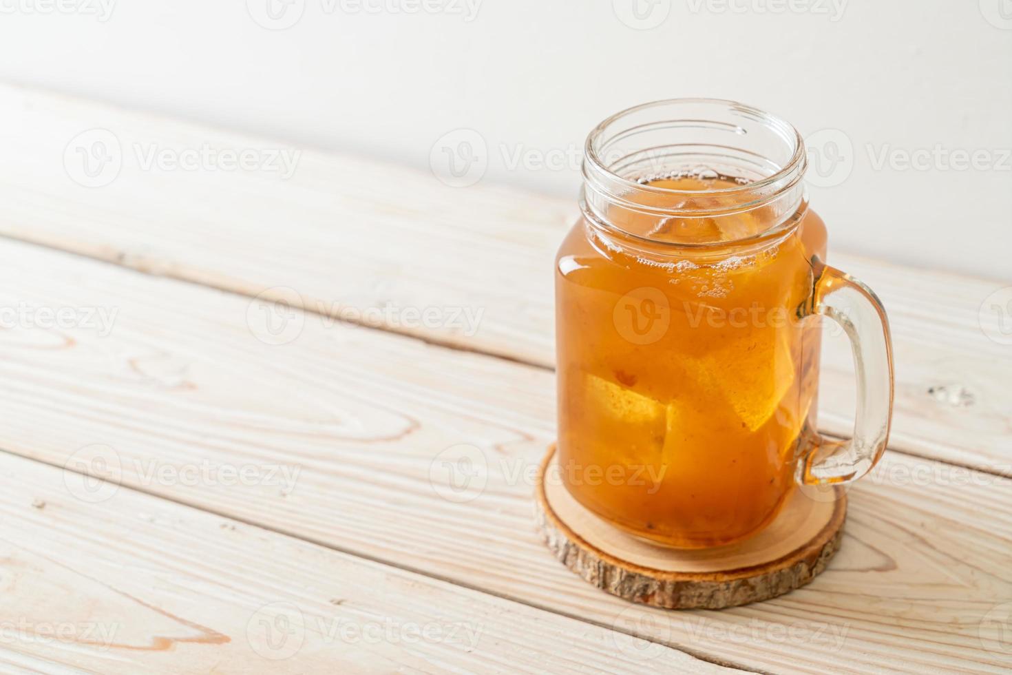 Delicious sweet drink tamarind juice and ice cube photo