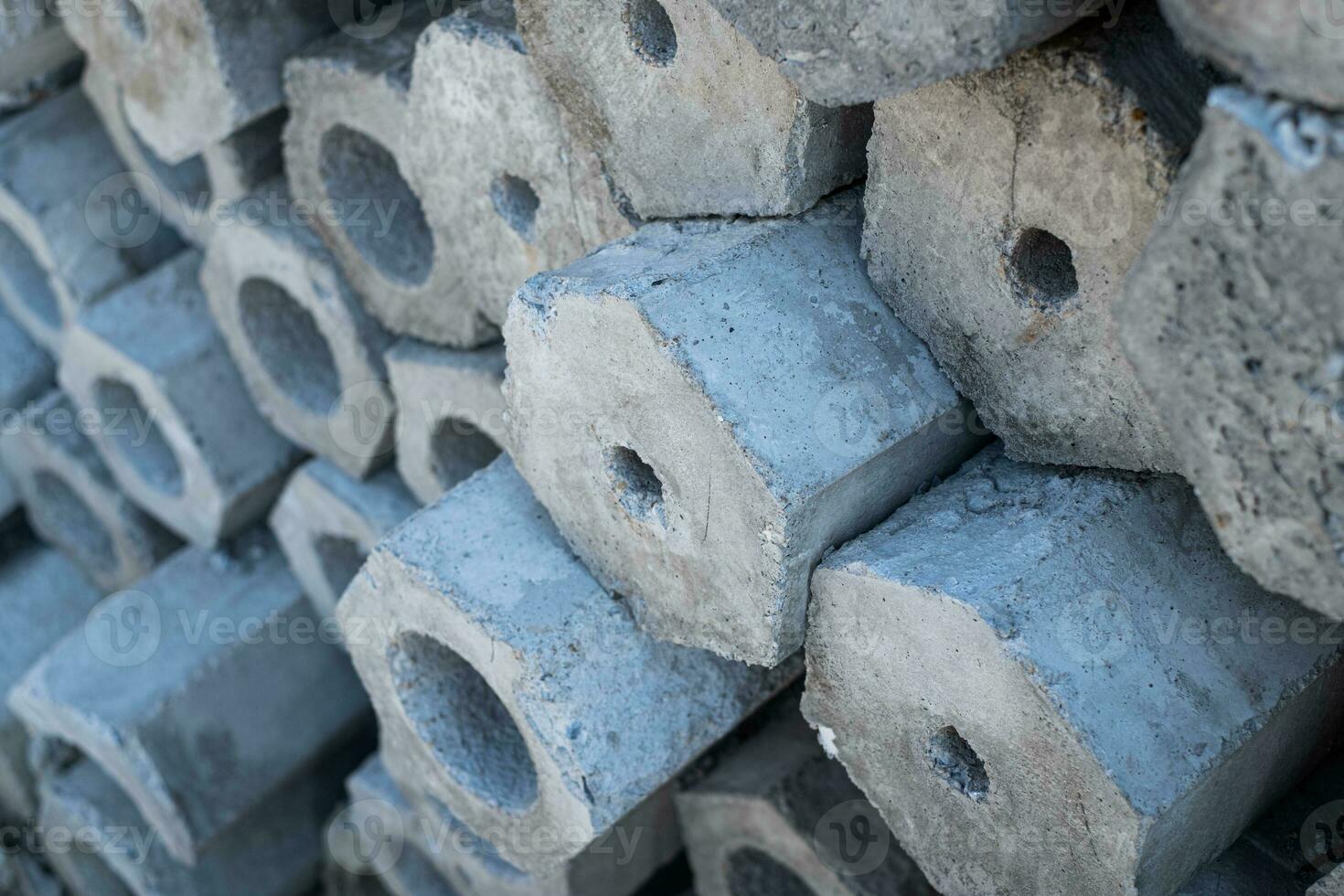 Close up cross-sectional area of stacked of concrete pile stake photo