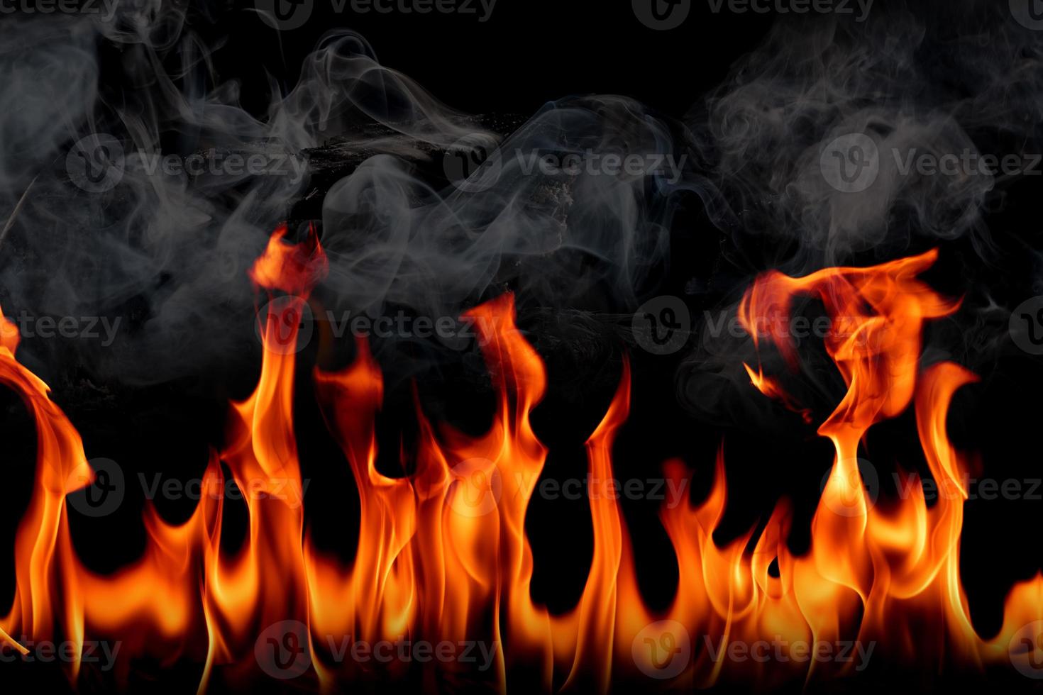 Fire flames with smoke on black background, Burning red hot sparks rise, Fiery orange glowing flying particles photo
