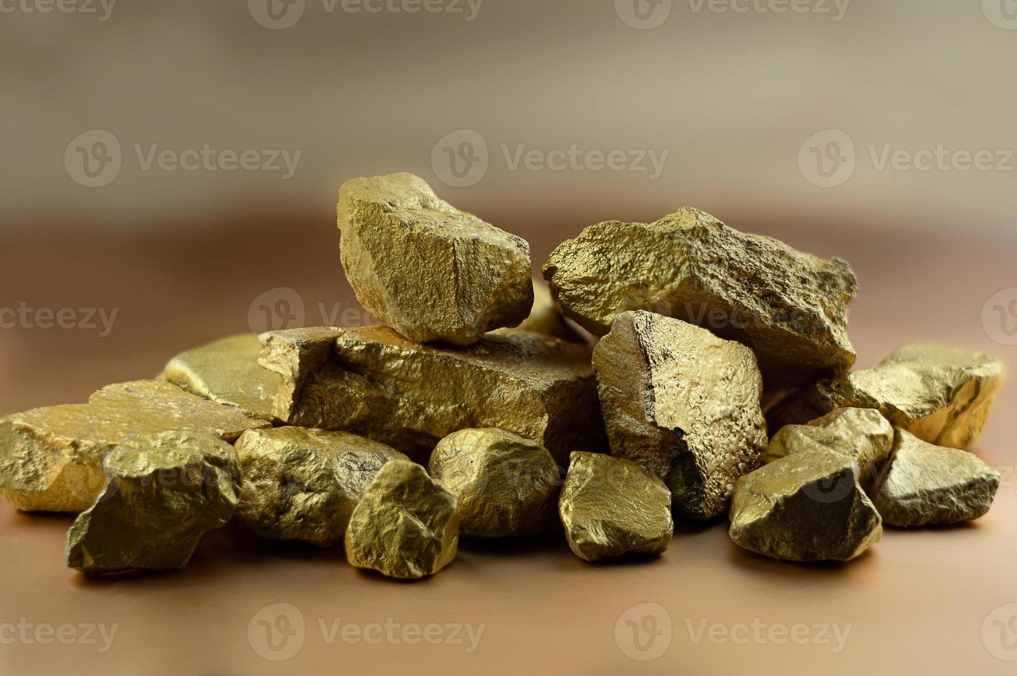 Group fo gold nugget at the golden background photo