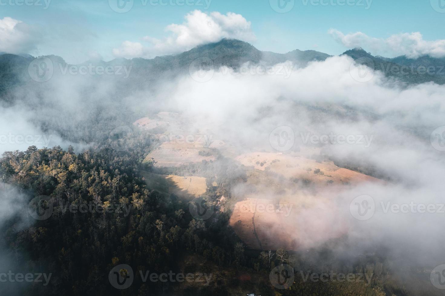 fog and mountains in the morning high angle photo