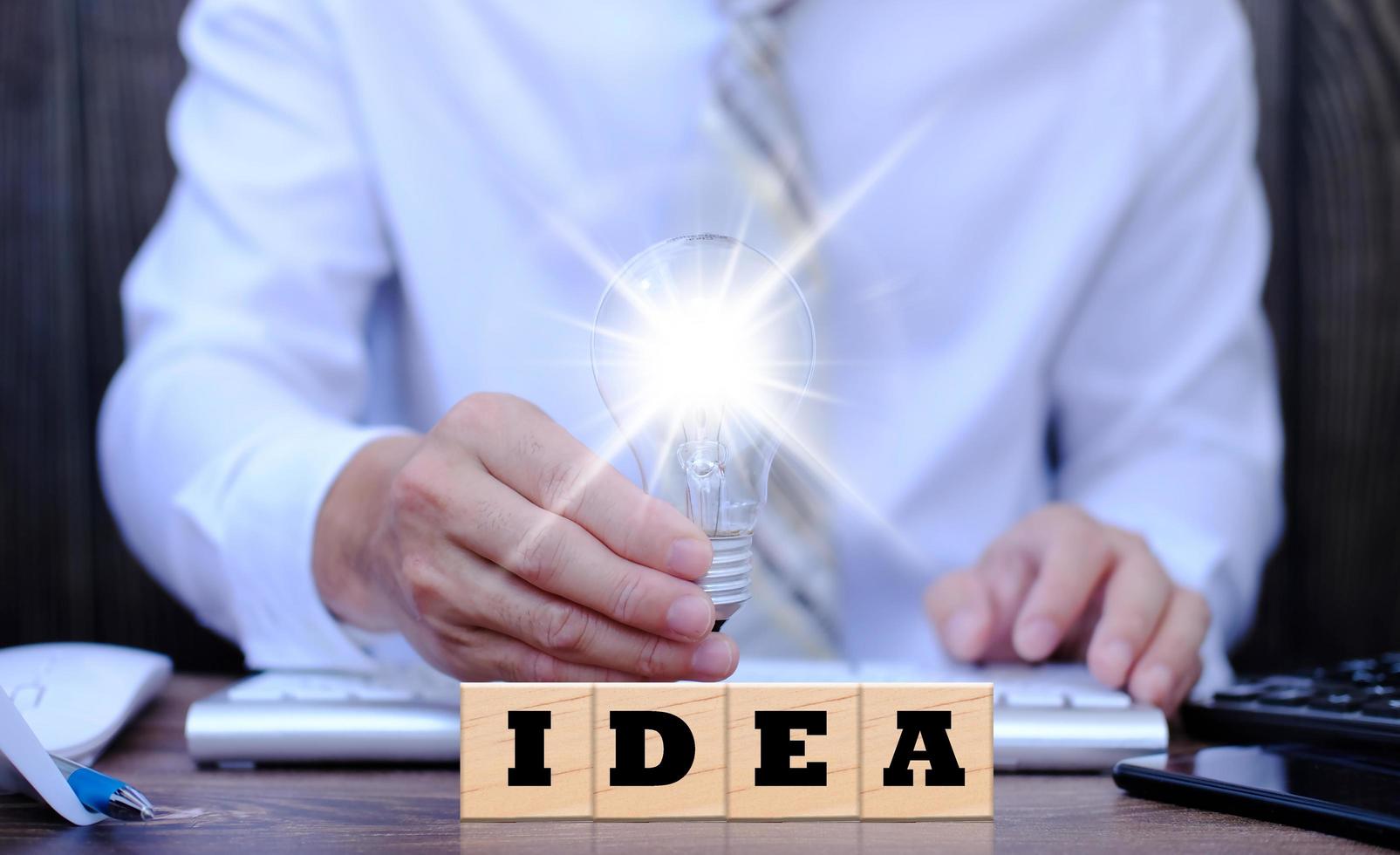 Businessman holding light bulb idea icon concept, innovation idea, industrial symbol, Innovative and creative ideas simple concept of light bulb business photo