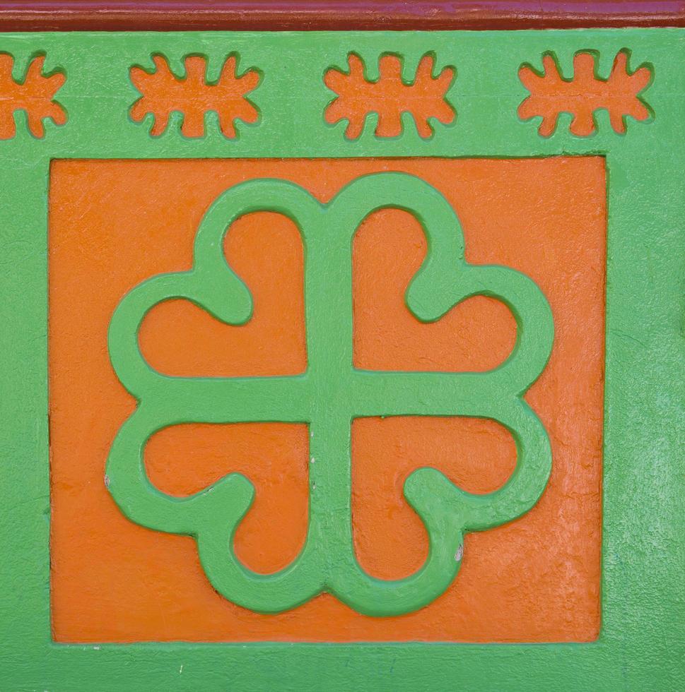GUATAPE, COLOMBIA, SEPTEMBER 11, 2019 - Detail from colorful facade on the building in Guatape, Colombia. Each building in town Guatape has bright color tiles along the lower part of facade. photo