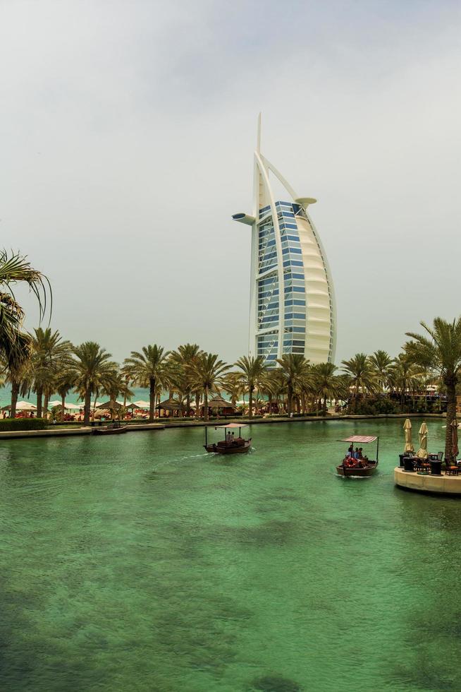 DUBAI, UAE, MAY 8, 2015 - Unidentified people at Madinat Jumeirah in Dubai. Madinat Jumeirah encompasses two hotels and clusters of 29 traditional Arabic houses. photo