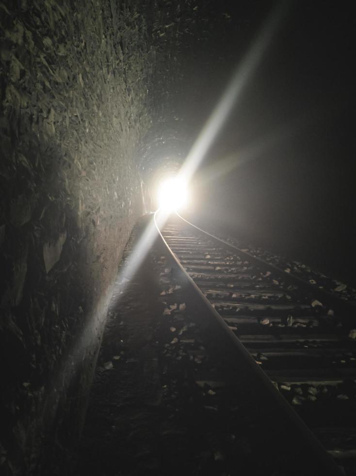 Light at the end of the train tunnel photo