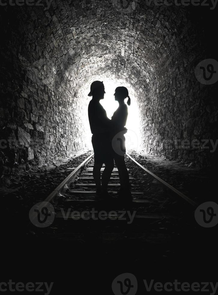 Silhouette loving couple end tunnel photo