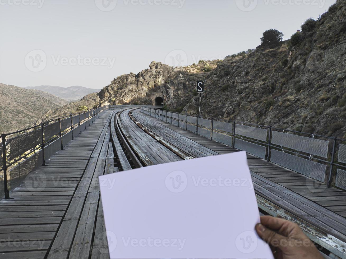 mockup man looking map in front bridge photo