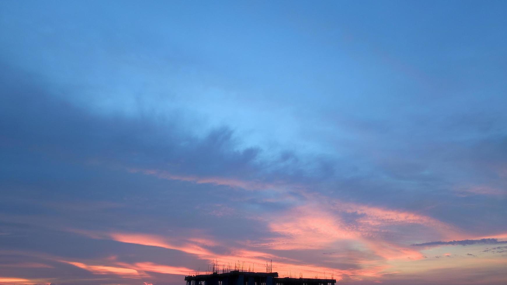 Sunset on blue sky. Blue sky with some clouds. blue sky clouds, summer skies, cloudy blue sky photo