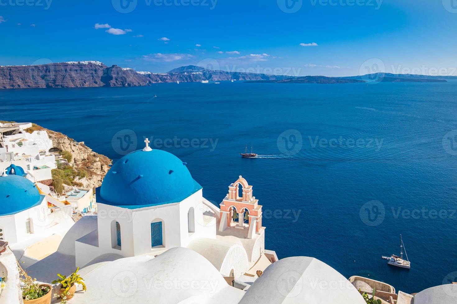 Santorini island, Greece. Incredibly romantic summer landscape on Santorini. Oia village in the morning light. Amazing view with white houses. Island of lovers, vacation and travel background concept photo