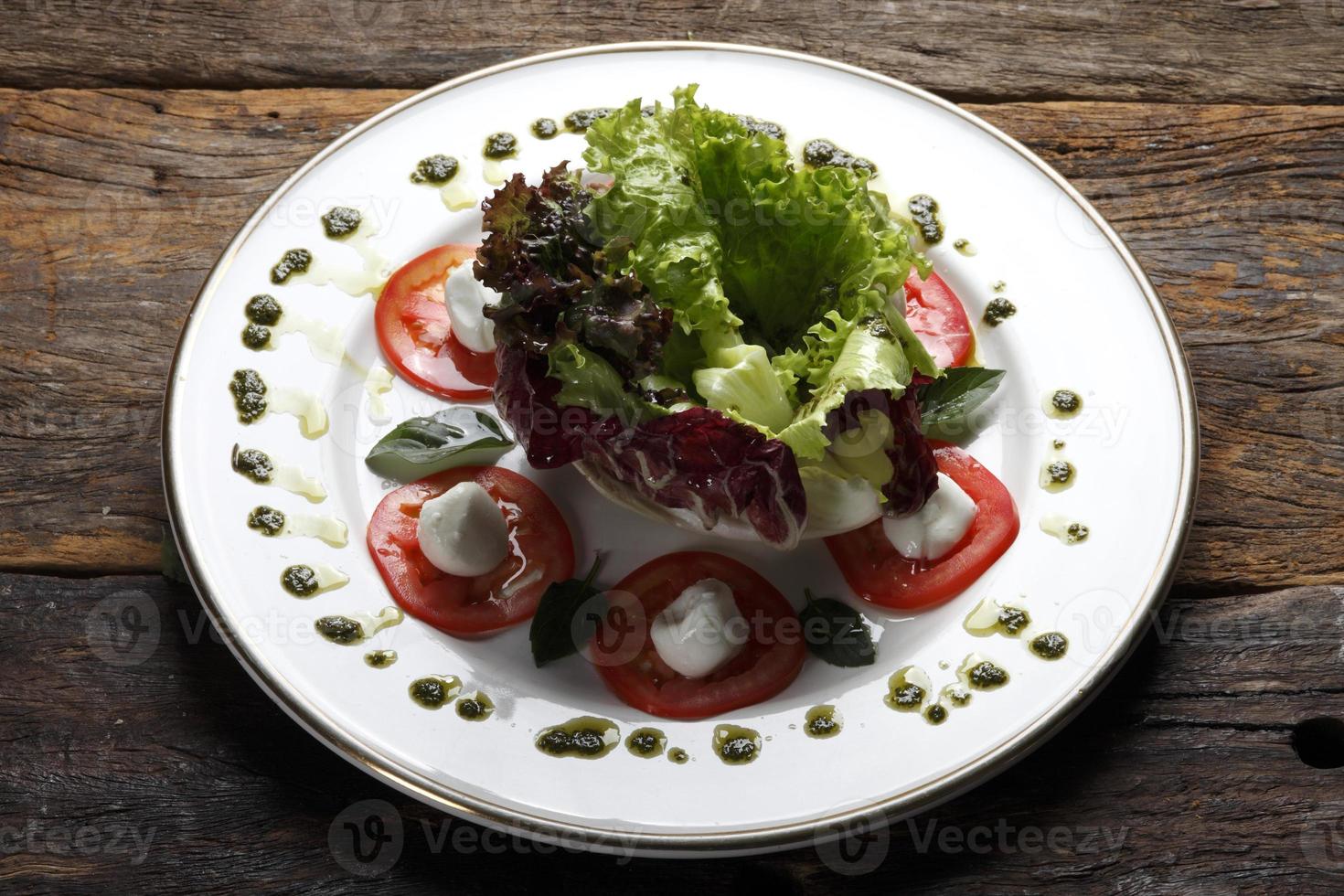 Dry tomato salad, bread and red wine photo