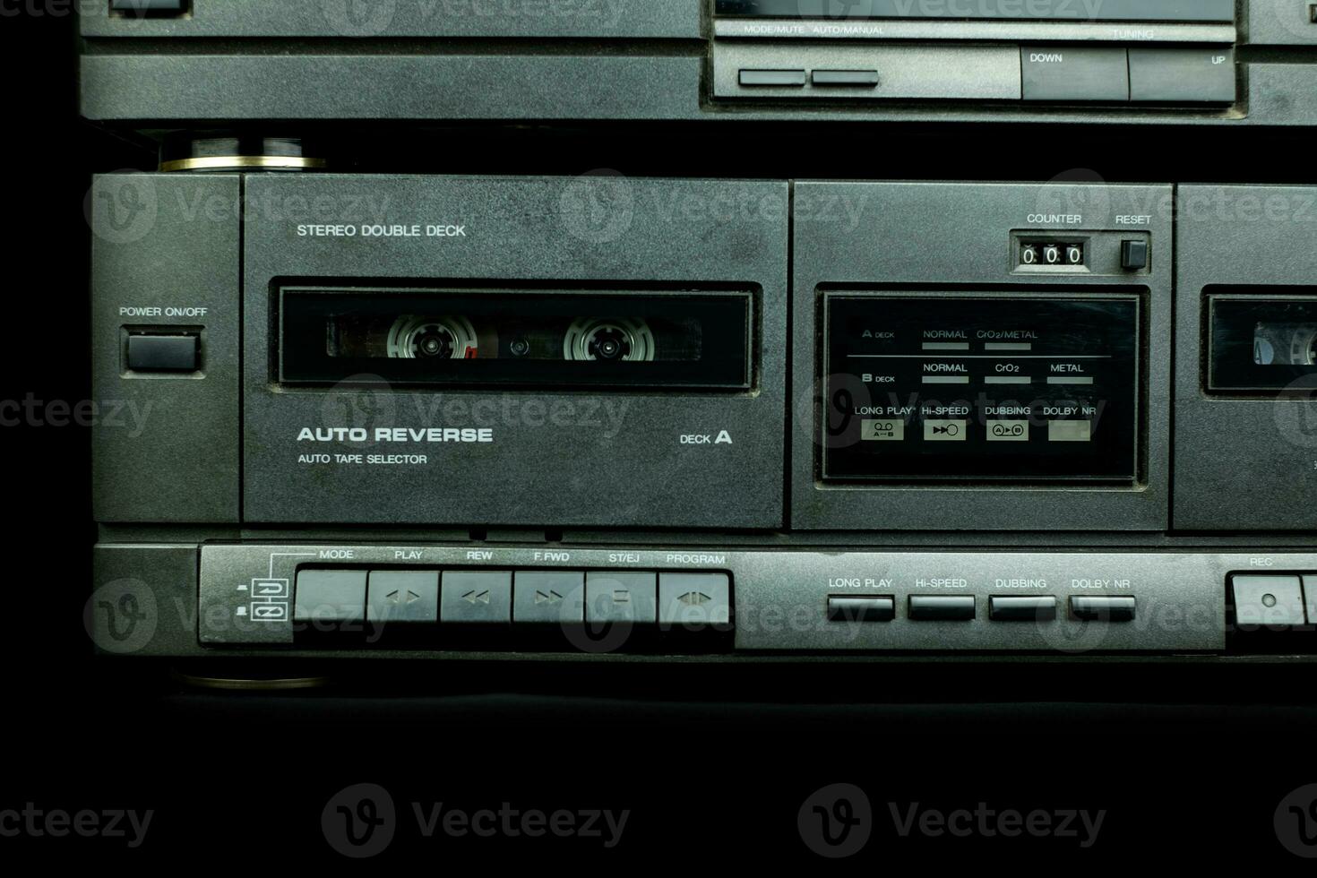 Close up front a deck recorder of the vintage stereo cassette tape player with the push operation buttons are retro technology photo