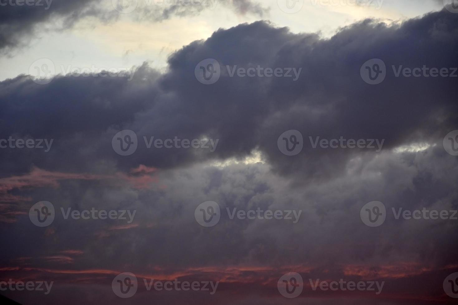 Sky with red and dark clouds. Crimson sunset. photo